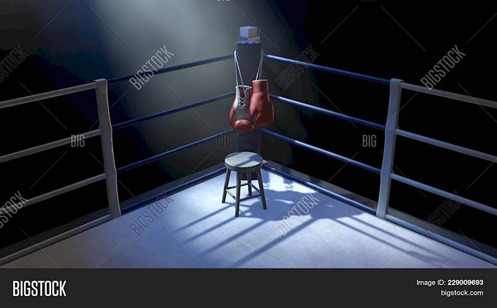 Боксерские перчатки на фоне ринга